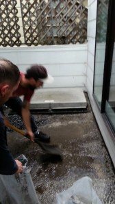 Colin and Tony, scraping sludgy dirty gravel in the rain. I love supervising. :)